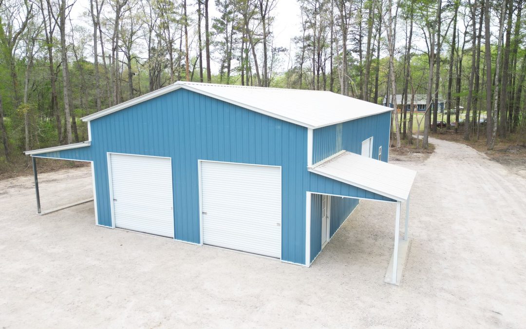 30’x60’x14’ fully enclosed metal structure featuring three 10’x10’ roll-up doors, one walk-in door, and four windows for natural light and ventilation.